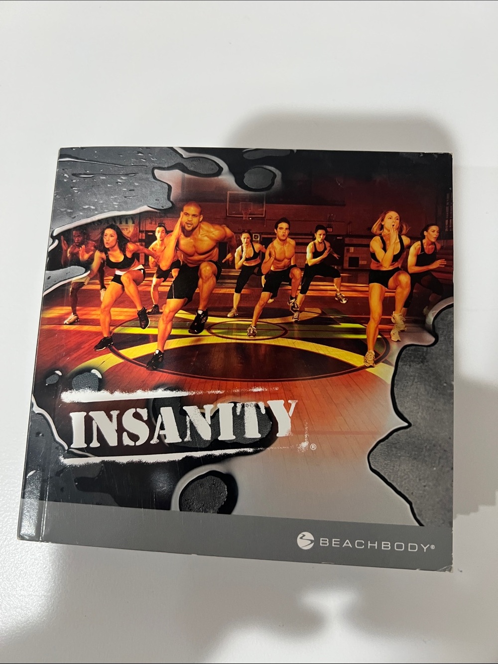 Beachbody Insanity Fitness Program - Black & Orange Cover